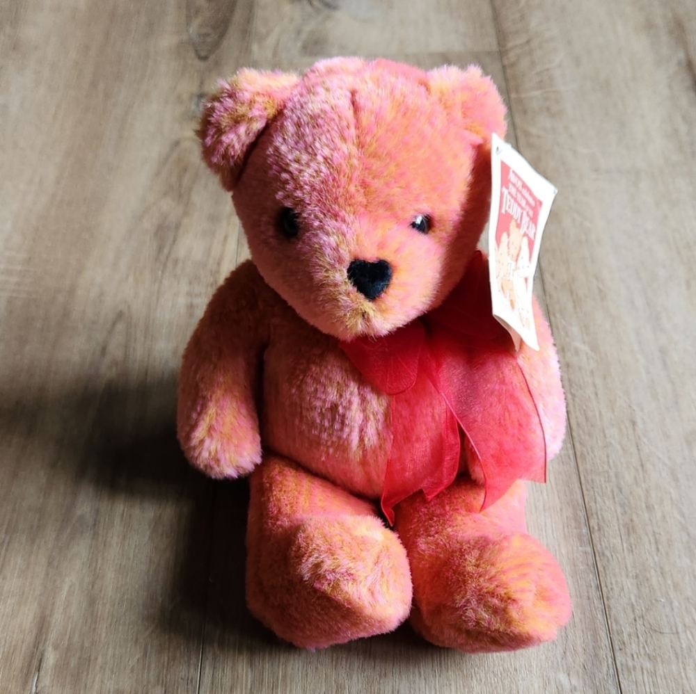 Avon teddy bear, color pink and yellow